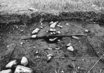 Excavation photograph : area 2c3 - half section - f2410/18, from south.