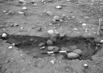 Excavation photograph : area 1 - f1111, half section, from east.