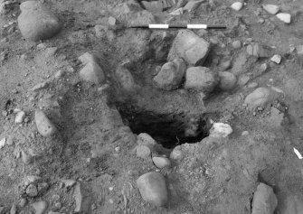 Excavation photograph : area 1 - f1205 - half section, from north.