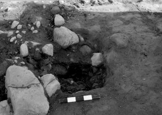 Excavation photograph : area 1 - f1227 - half section, from south.