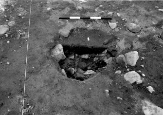 Excavation photograph : area 1 - f1222 - half section, from south.