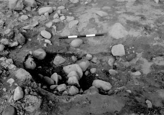 Excavation photograph : area 1 - f1226 - half section, from south.
