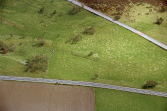 Aerial view of Chapelton hut circles, W of Boat of Garten, Speyside, looking SSE.