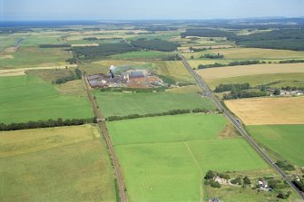 Aerial view of Norbord Factory and Morayston area, E of Inverness, looking E.