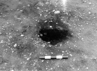 Excavation photograph : trench III - posthole AFH, half sectioned, part of post structure A.