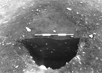 Excavation photograph : trench IV - feature DAB, multifill pit/posthole, half section.
