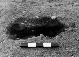 Excavation photograph : trench V - features EDT and EDS, half sectioned.