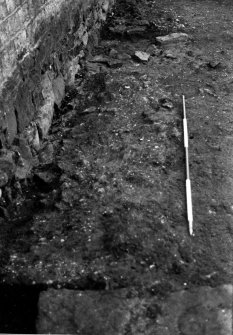 Excavation photograph : trench 2 - clay/rubble mix f138, from E.