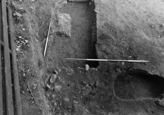 Excavation photograph : trench 5, burnt stone and clay, from S.