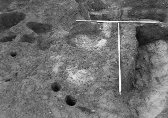 Excavation photograph : pits f728 and 816 partially excavated, from E.