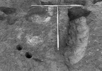 Excavation photograph : pits f728 and 816 partially excavated, from E.