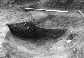 Excavation photograph : close up of section across feature f911, from W.