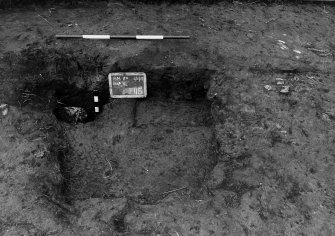 Excavation photograph.  F115 as found, previously partly excavated, from north-east.