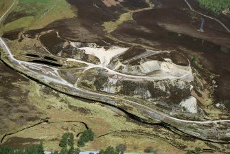 Close up aerial view of quarry in Strathrory, N of Alness, Easter Ross, looking NNE.