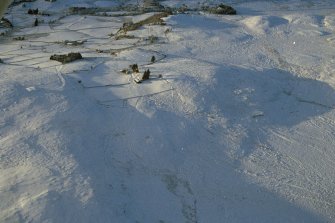 Oblique aerial view of hut circles and field systems at Cnoc-an-t-Sidhean, Rogart, East Sutherland, looking NW.