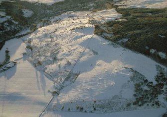 Oblique aerial view of Torboll Farm, Strath Fleet, East Sutherland, looking SW.