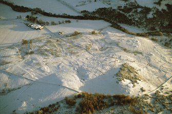 Oblique aerial view of Torboll Farm, Strath Fleet, East Sutherland, looking SE.