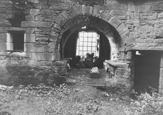 Excavation archive: Window embrasure leading to private chamber in thickness of wall (W); doorway leading to stair on right. From S.