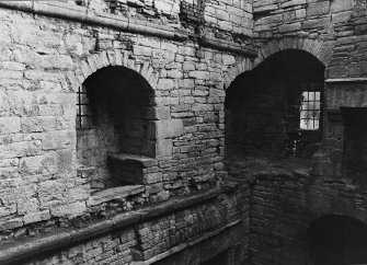 Excavation archive: Interior of tower at second floor level, showing remains of mural chamber in SE corner and window embrasure in E wall. From NW.