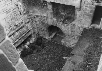 Excavation archive: Interior of tower prior to clearance of debris from first floor hall. From NW.