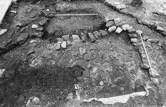 Excavation photograph : remains of gatehouse after removal of topsoil, from north.