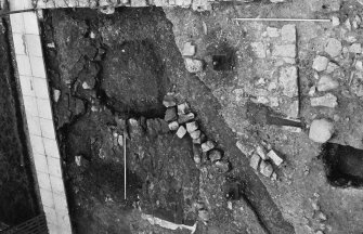Excavation photograph : interior of gatehouse area after partial removal of 1968 backfill, from south.