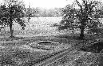 Excavation photograph : foundations of one of the twin gatehouse towers, from east.