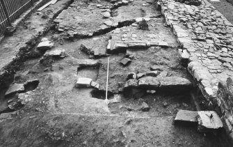 Excavation photograph : view along trench 3 showing main surviving elements of gatehouse, from west.