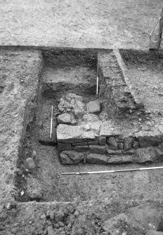 Excavation photograph : trench S, corner of building, from W.
(B&W negatives colour printed)