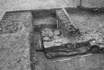 Excavation photograph : trench S, corner of building, from W.
(B&W negatives colour printed)
