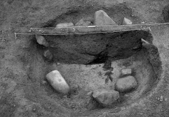 Excavation photograph : area 3 - f3123, pit section with charcoal object.