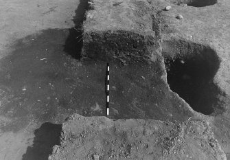 Excavation photograph : area 3 - f3146/3088 pre ex (3088 half section) detail, from S.