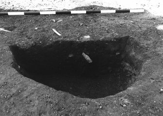 Excavation photograph : area 4A - f4118, half section, from E.