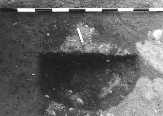 Excavation photograph : area 4A - f4114, half section, from E, close up.