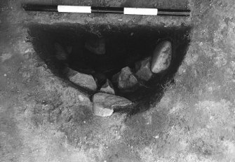 Excavation photograph : area 4A - f4034, poss. primary packing in situ.