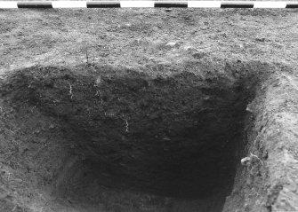 Excavation photograph : area 4A - f4126, close up of full half section, from S.