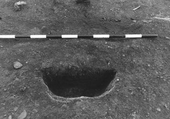 Excavation photograph : area 4A - f4106, half section, from E.