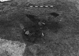 Excavation photograph : area 4A - f4099/4100, 4011, two half sections removed, from S.