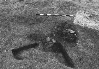 Excavation photograph : area 4A - f4099/4100, 4011, two half sections removed, general shots, from N.