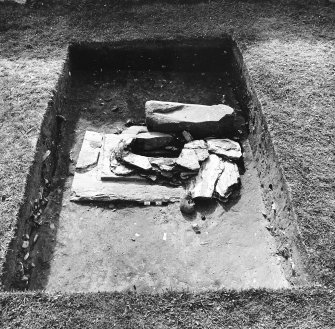 Excavation of cross-base, Kilnave Church, Kilnave.
View of cross-base from the East showing possible original packing stones on top of the base slab.