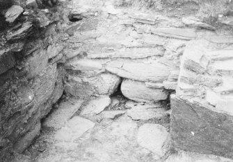 Photograph taken during excavation. Walling immediately N of altar, from W.