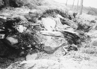 photograph taking during excavation, probably of boundary wall.