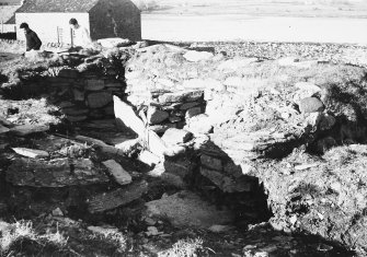 Photograph taken during excavation. Altar, doorway, exterior and interior from SW.