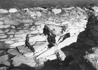 Photograph taken during excavation. Altar from W. NB print may be reversed.