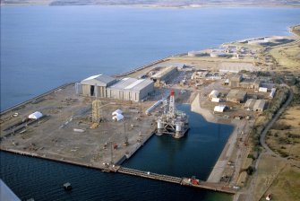 Aerial view of Nigg Fabrication Yard & Graving Dock, Cromarty Firth, looking NW.