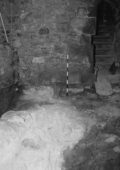 Excavation photograph : area A - looking along wall to junction with east wall of tower.