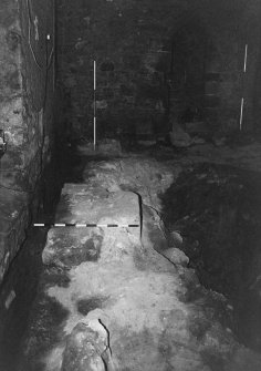 Excavation photograph : area A - looking along full length of barbican wall 4 to E wall of tower.