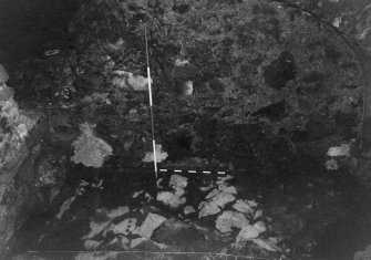 Excavation photograph : area B - worn slightly disturbed bedrock until recent shallow gravelly flooring.