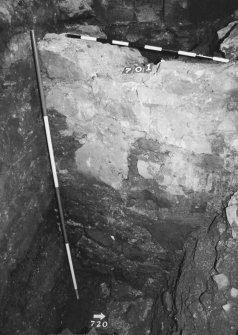 Excavation photograph : area K - wall exposed down to mortar spread at foot.