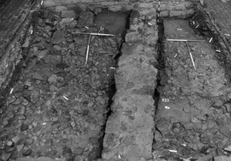 Excavation photograph : area N - construction slots for wall 908 emptied, feature 930 fully excavated.